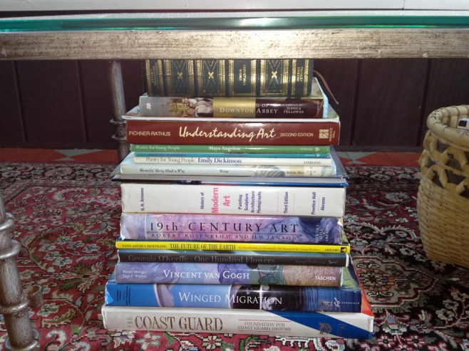 Books under the coffee table.