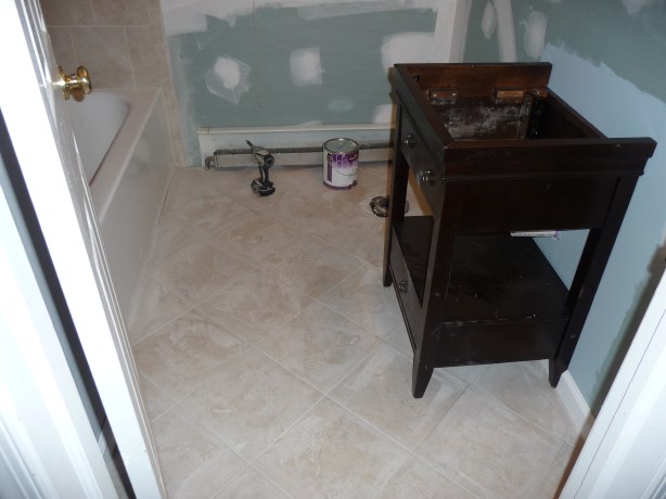 Greenboard on the walls, a new vanity and grout.