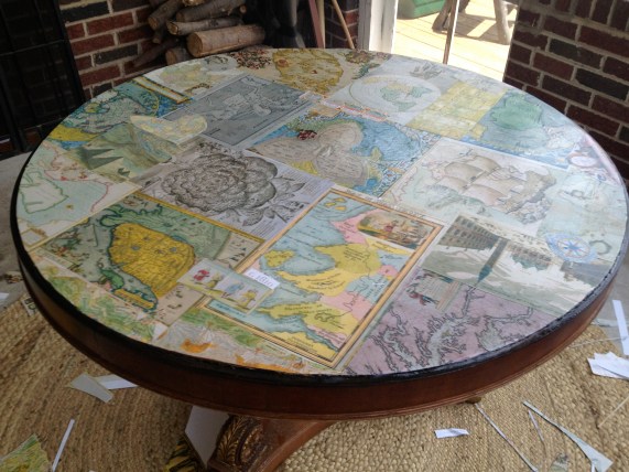 Mod Podge Map Table. During the project.
